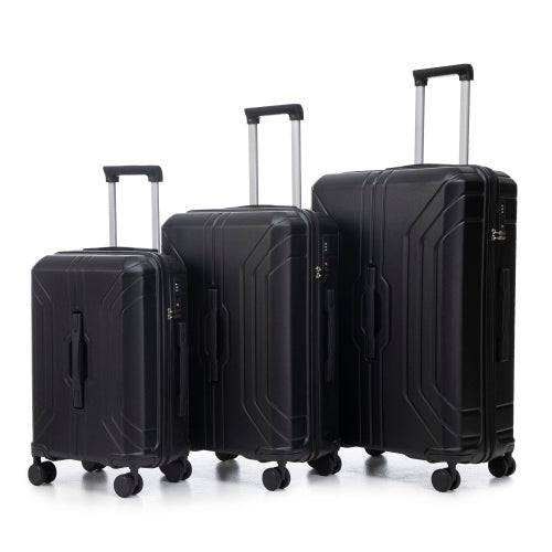 Set of three black suitcases of different sizes on a white background