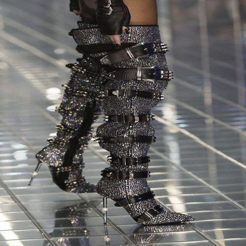 Studded pants and boots on a reflective floor