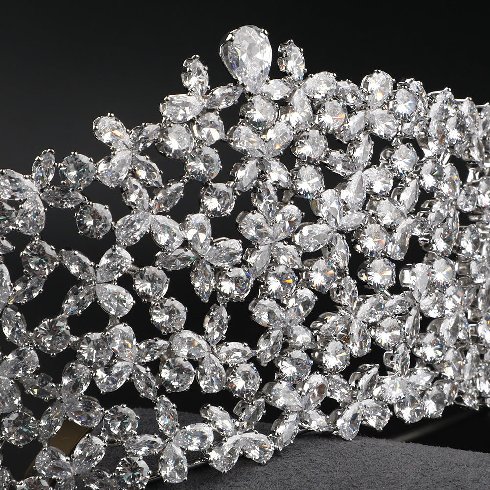 Close-up of a tiara with sparkling diamonds on a black background