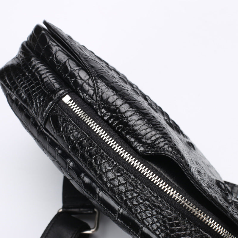 Black textured bag with a zipper on a white background