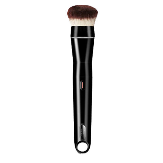 Black makeup brush with brown and white bristles on a white background