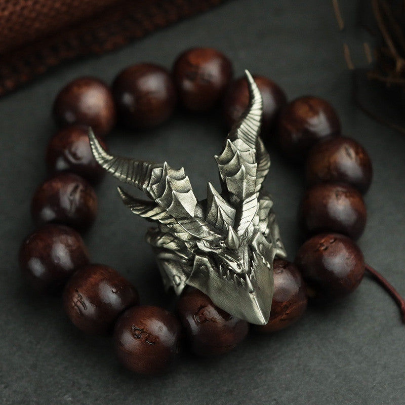 Bracelet with dragon-shaped clasp on wooden beads