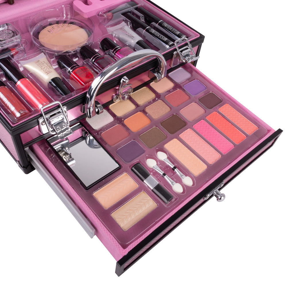 Makeup set with various products in a pink case on a white background