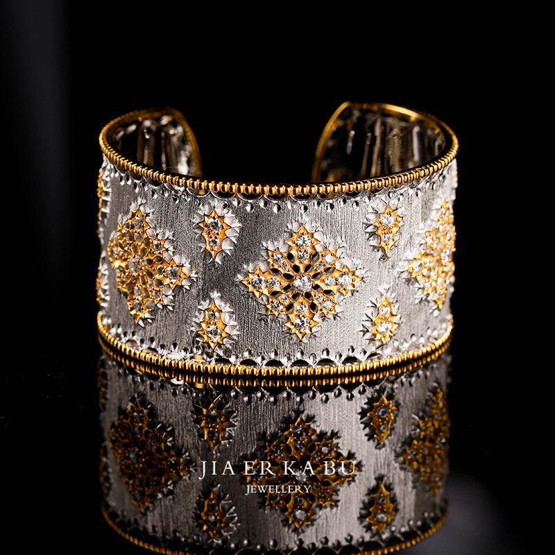 Decorative bracelet with gold and silver patterns on a black background, featuring the brand 'Jiaer K Abu'.