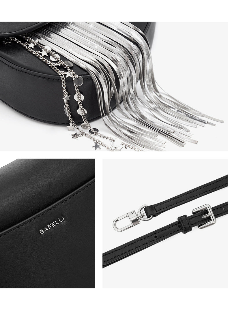 Black handbag with a detachable strap featuring stars and beads, branded 'Bafelli'.