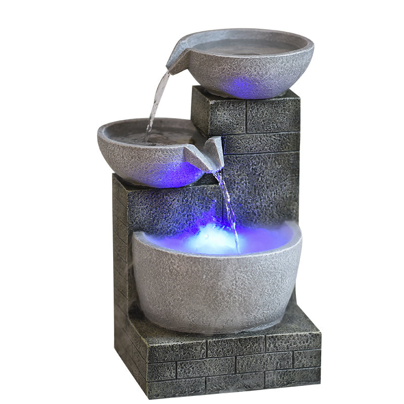Outdoor water fountain with LED lights on a white background