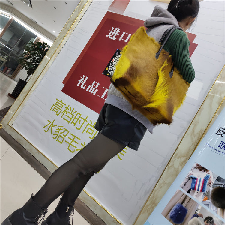 Person carrying a yellow backpack in front of a store sign with Chinese text