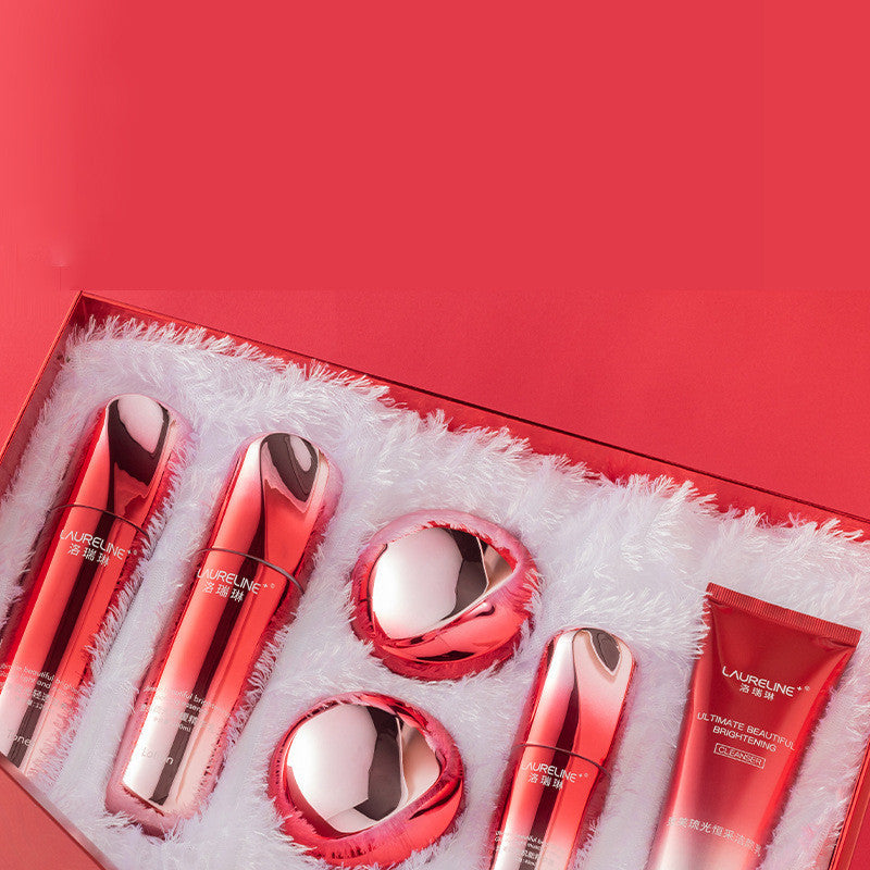 Set of red cosmetic products in a box with a red background