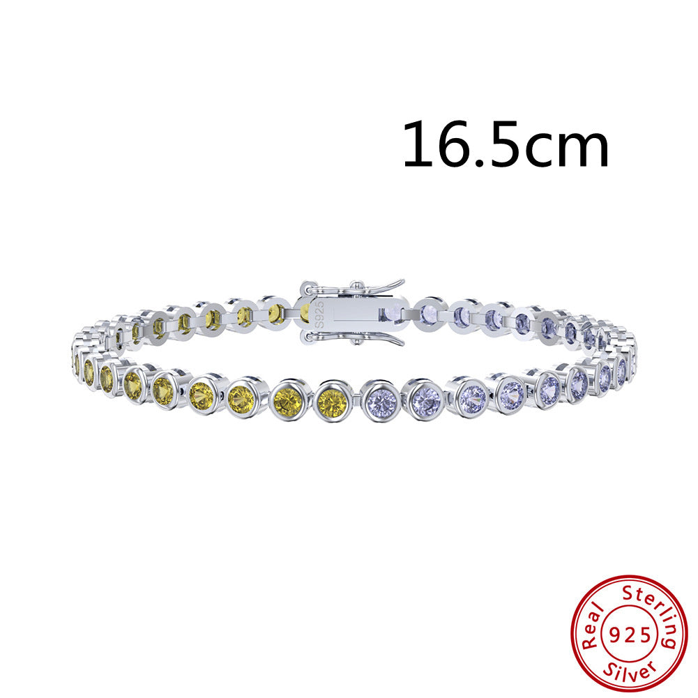 Silver bracelet with colorful stones and 'Real Sterling Silver' stamp on a white background