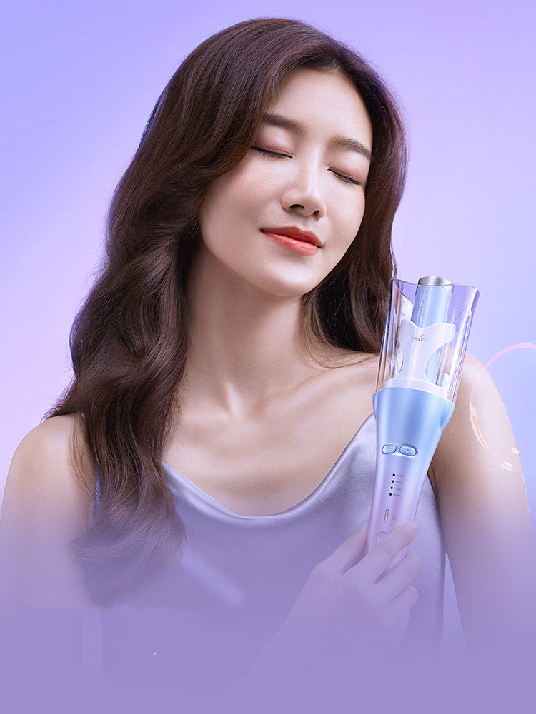 Woman holding a hair straightener against a purple background