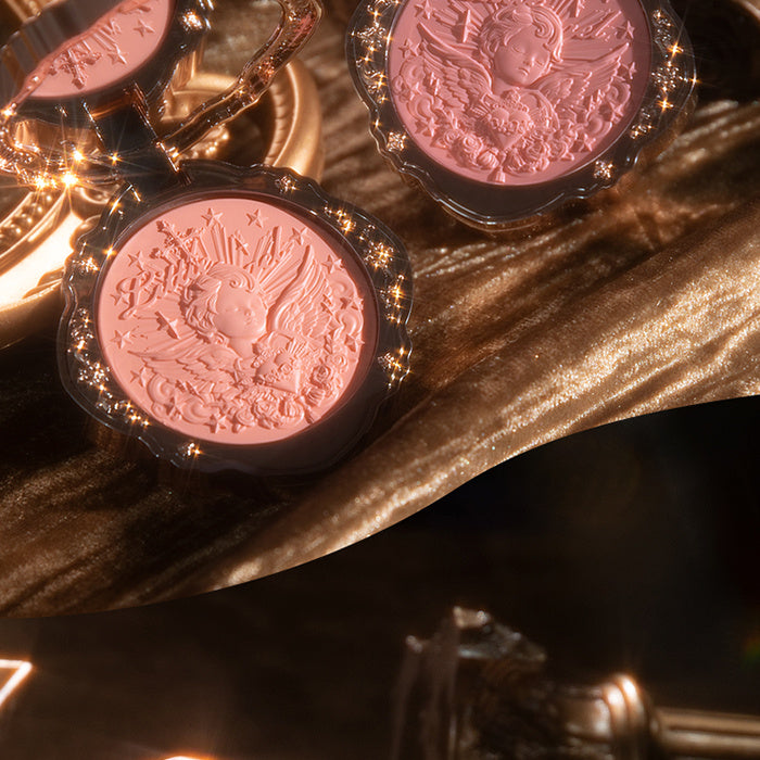 Close-up of pink coins with embossed designs on a dark background