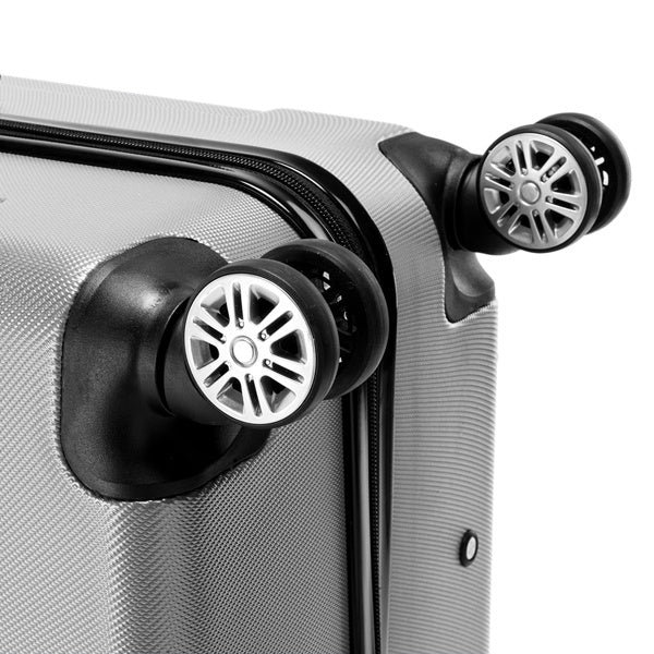 Close-up of a silver suitcase with black wheels on a white background