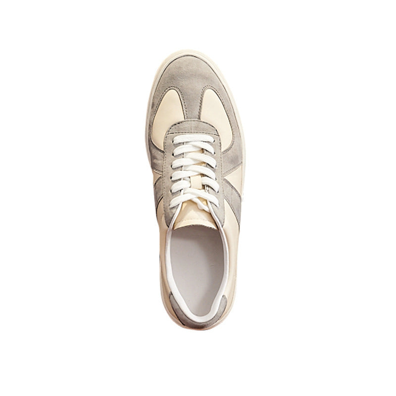 Beige and white sneaker on a white background