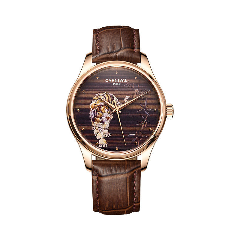 Watch with brown leather strap and tiger design on dial against white background