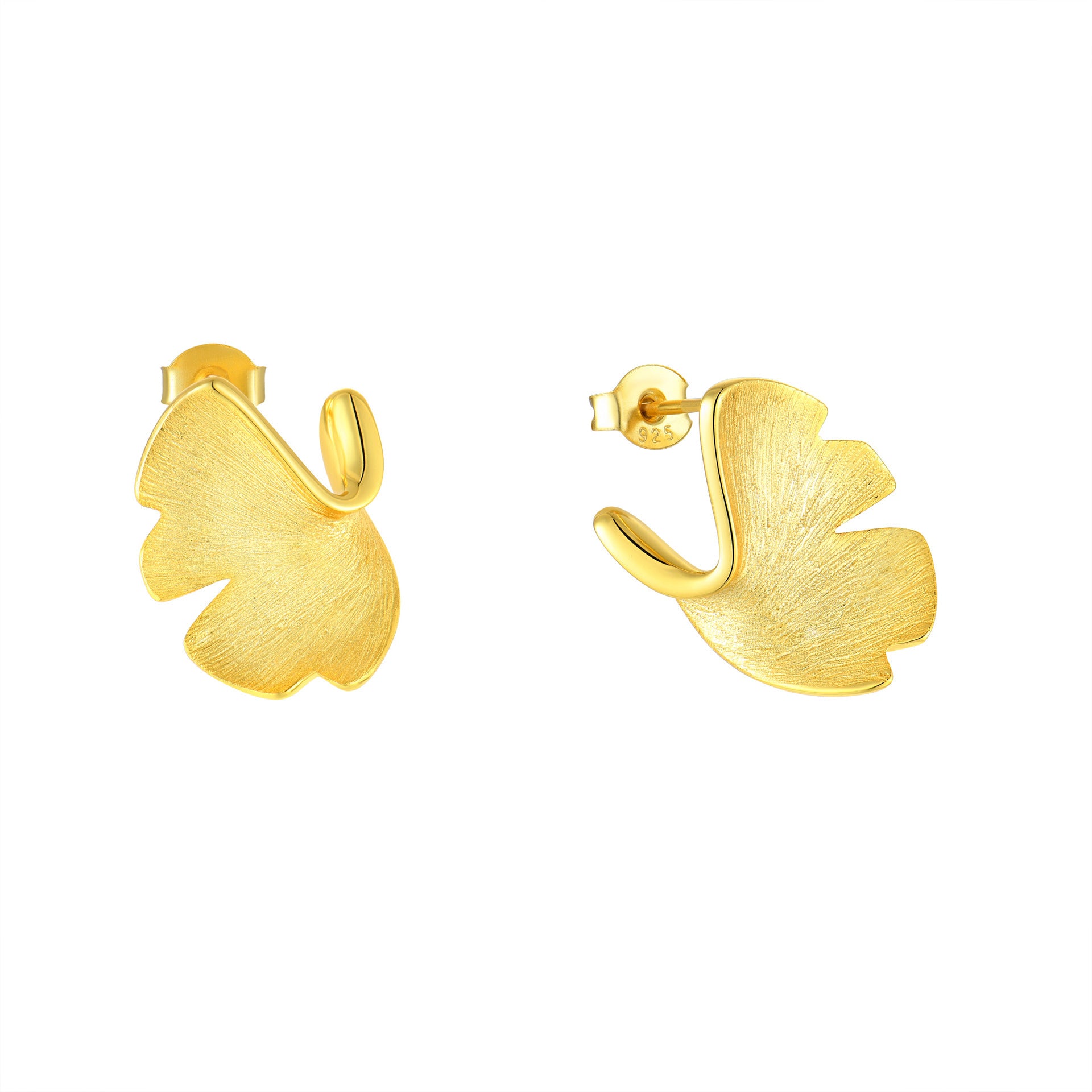 Gold leaf-shaped earrings on a white background