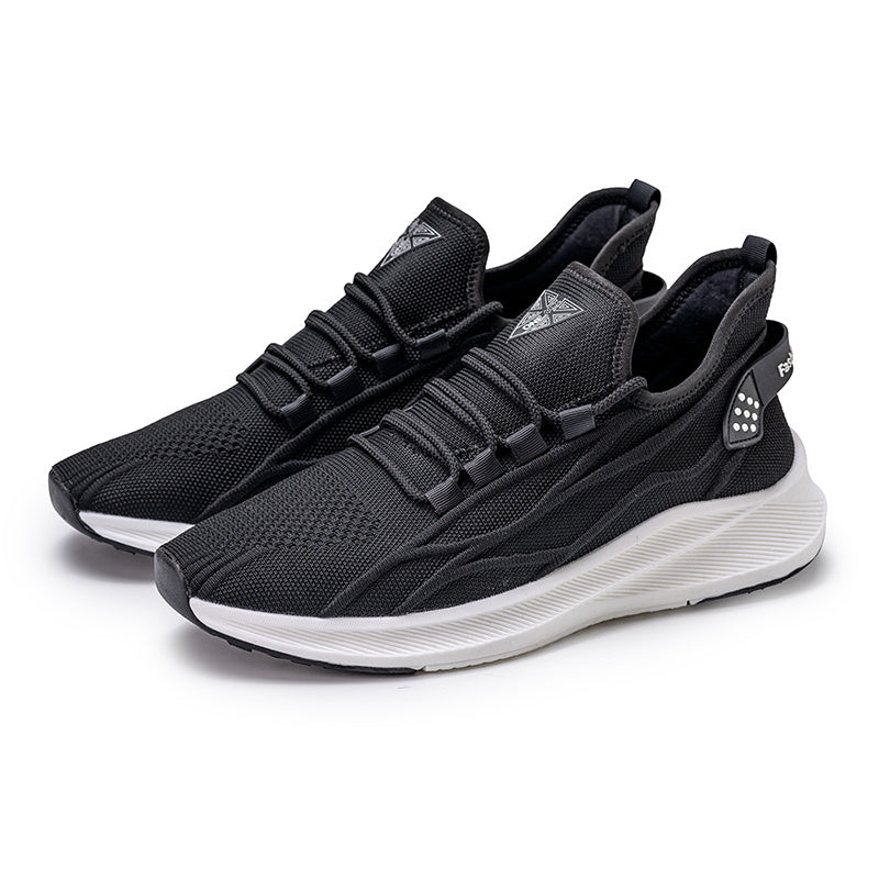 Black athletic shoes with white soles on a white background
