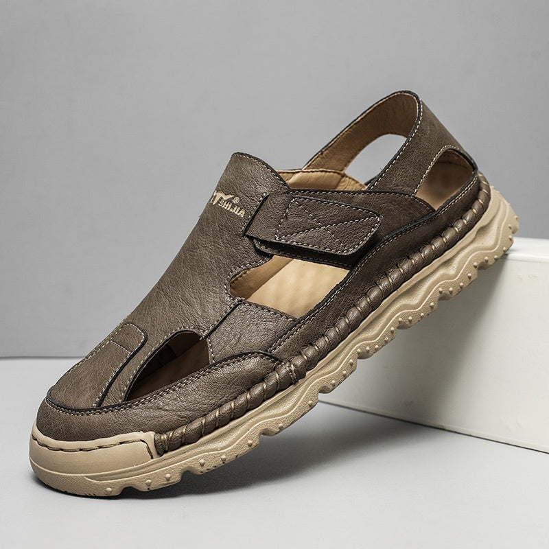 Brown sandal with a beige sole on a gray background