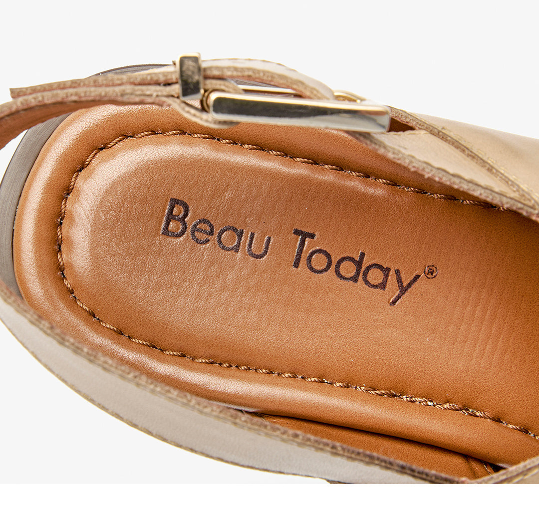 Close-up of a sandal with 'Beau Today' branding on a white background