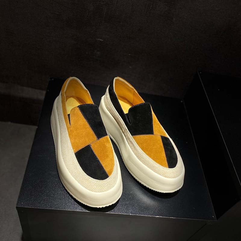 Pair of loafers with a geometric design on a black platform
