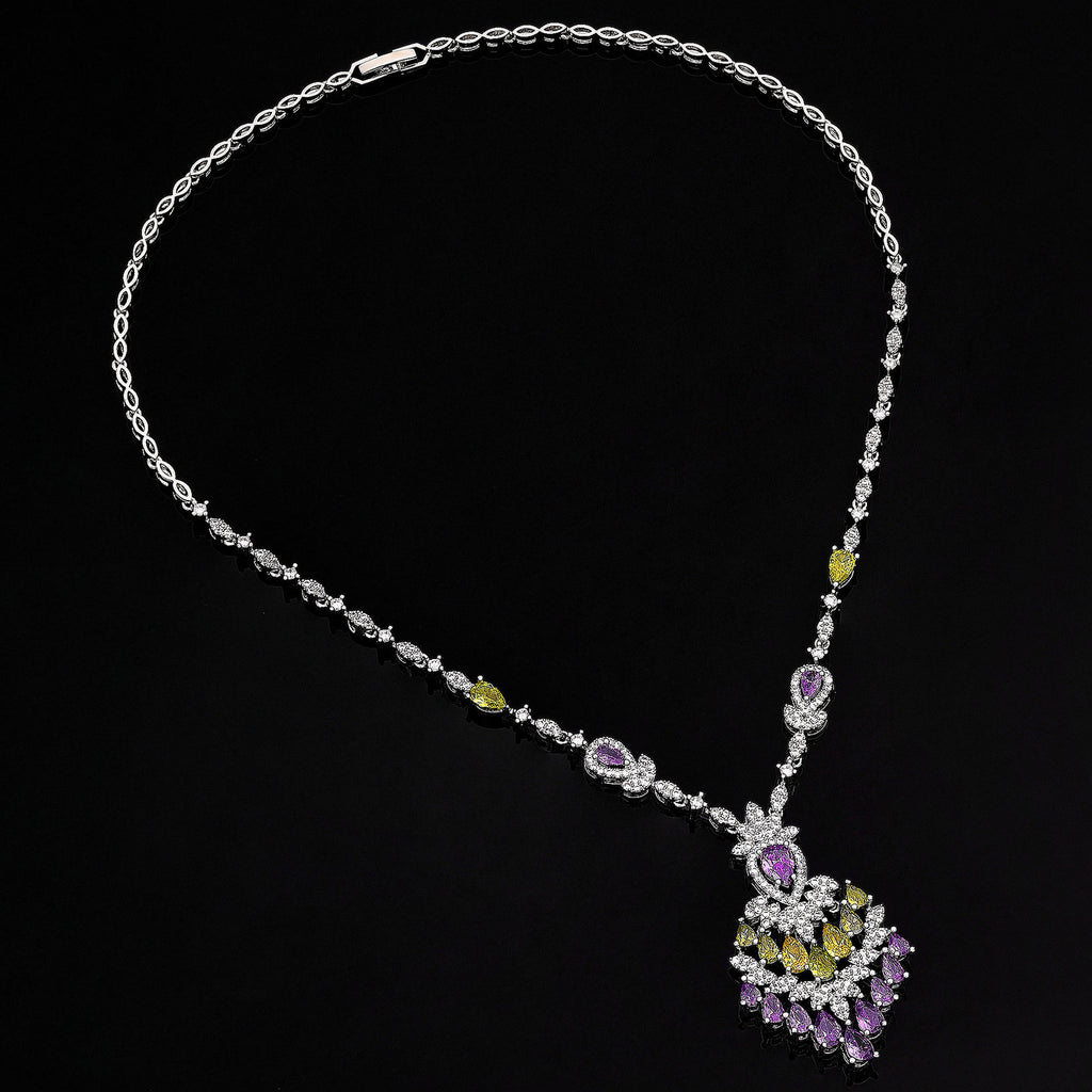 Necklace with a peacock feather pendant on a black background
