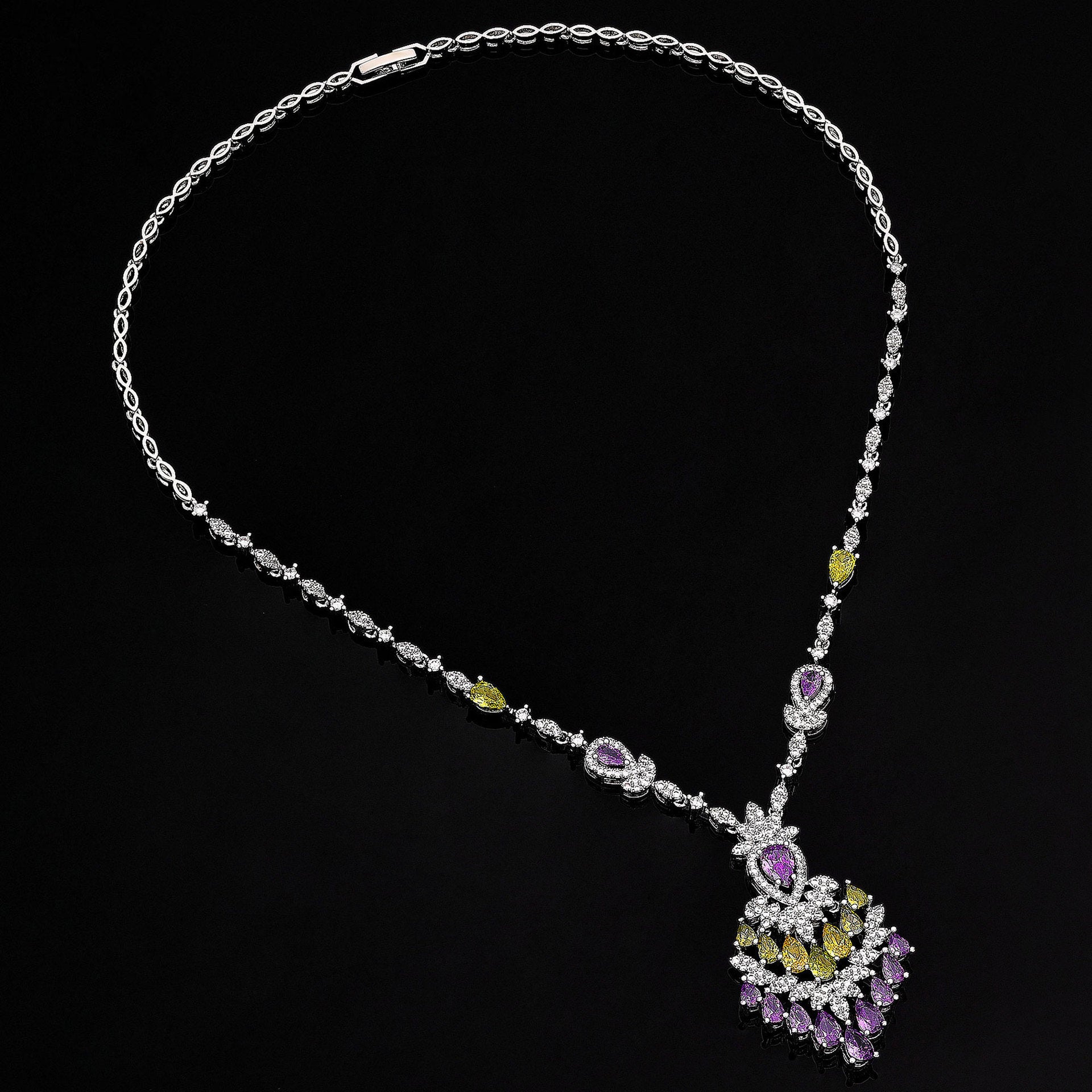 Necklace with a peacock feather pendant on a black background