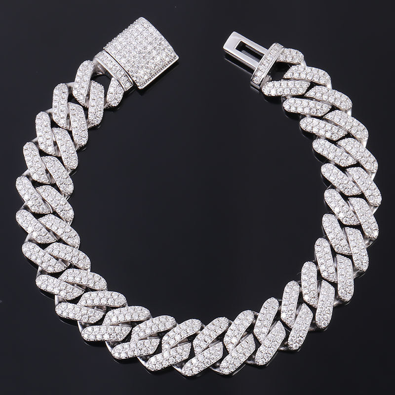Silver chain bracelet with diamond-like stones on a black background