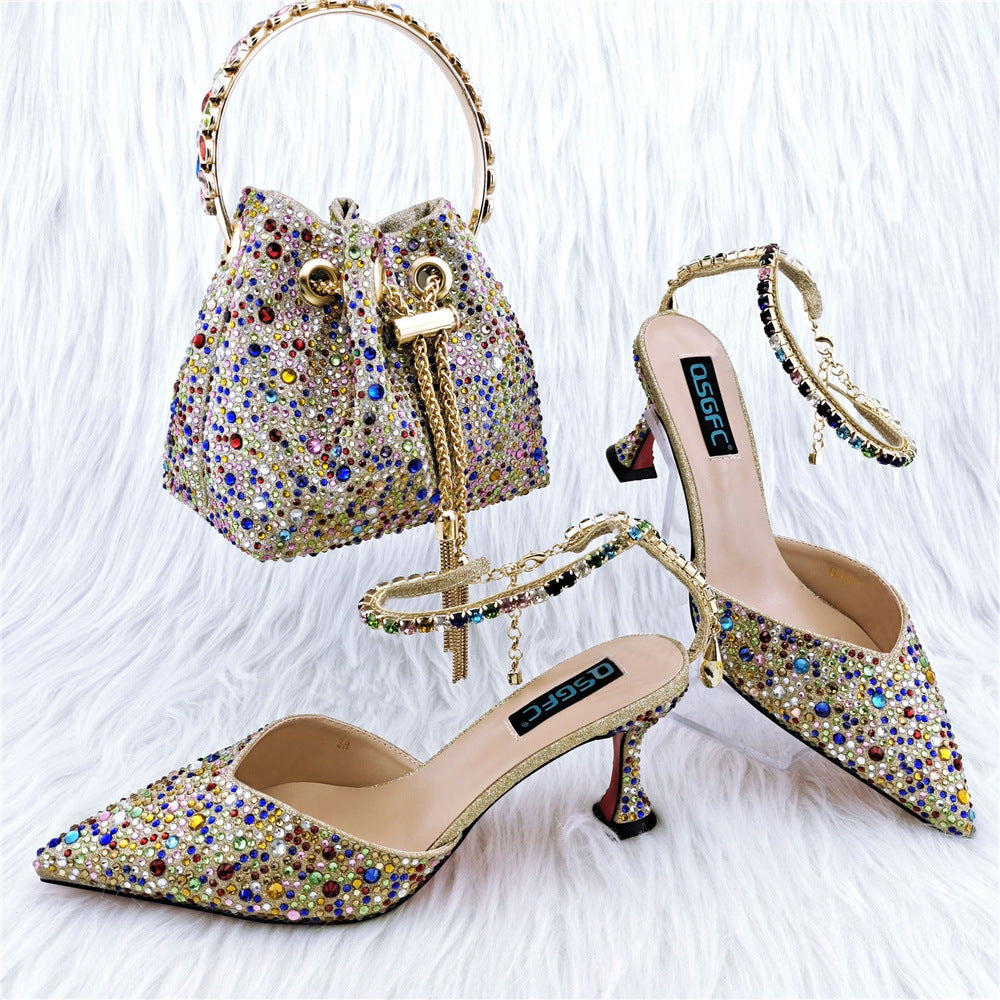 Pair of embellished high-heeled shoes with a matching handbag on a white background