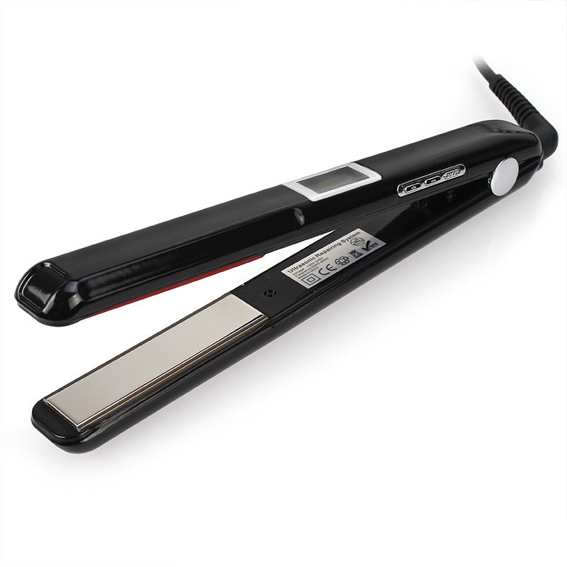 Black hair straightener on a white background