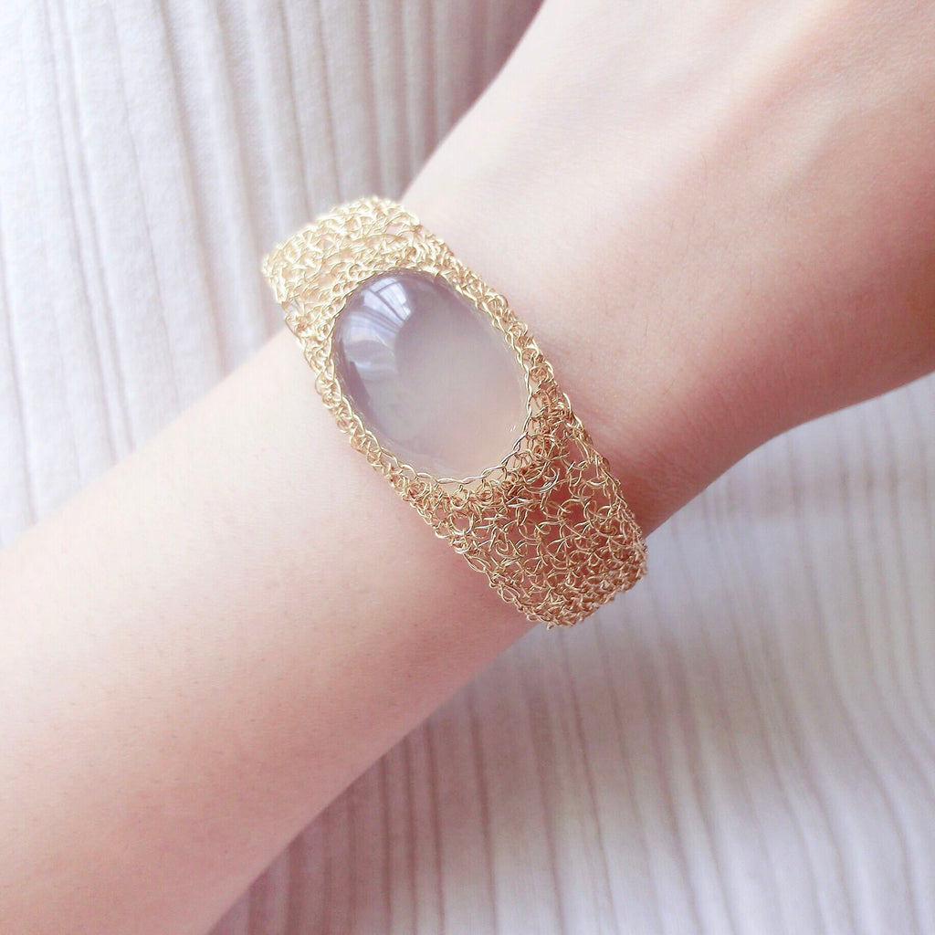 14k Gold Wire Natural White Chalcedony Bracelet on wrist with delicate gold wire mesh and smooth white chalcedony stone