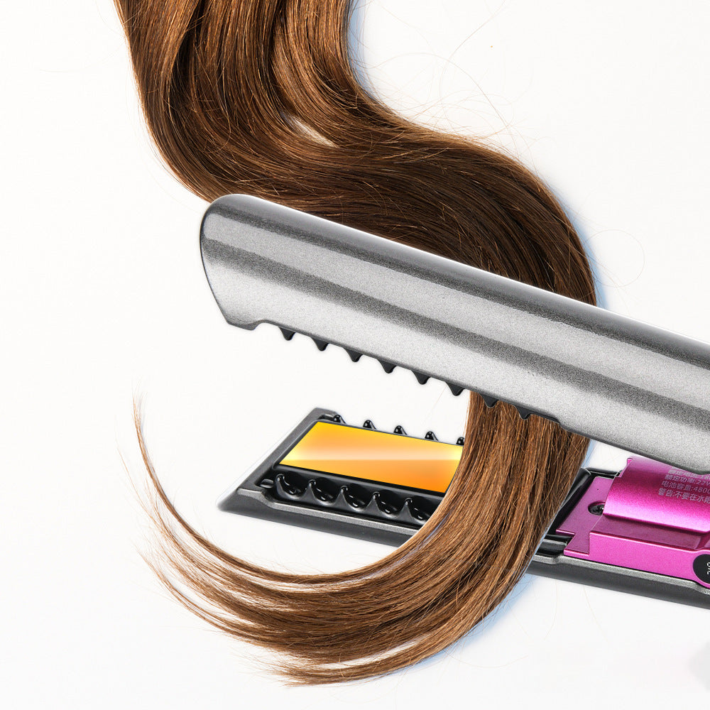 Hair straightener with brown hair on a white background