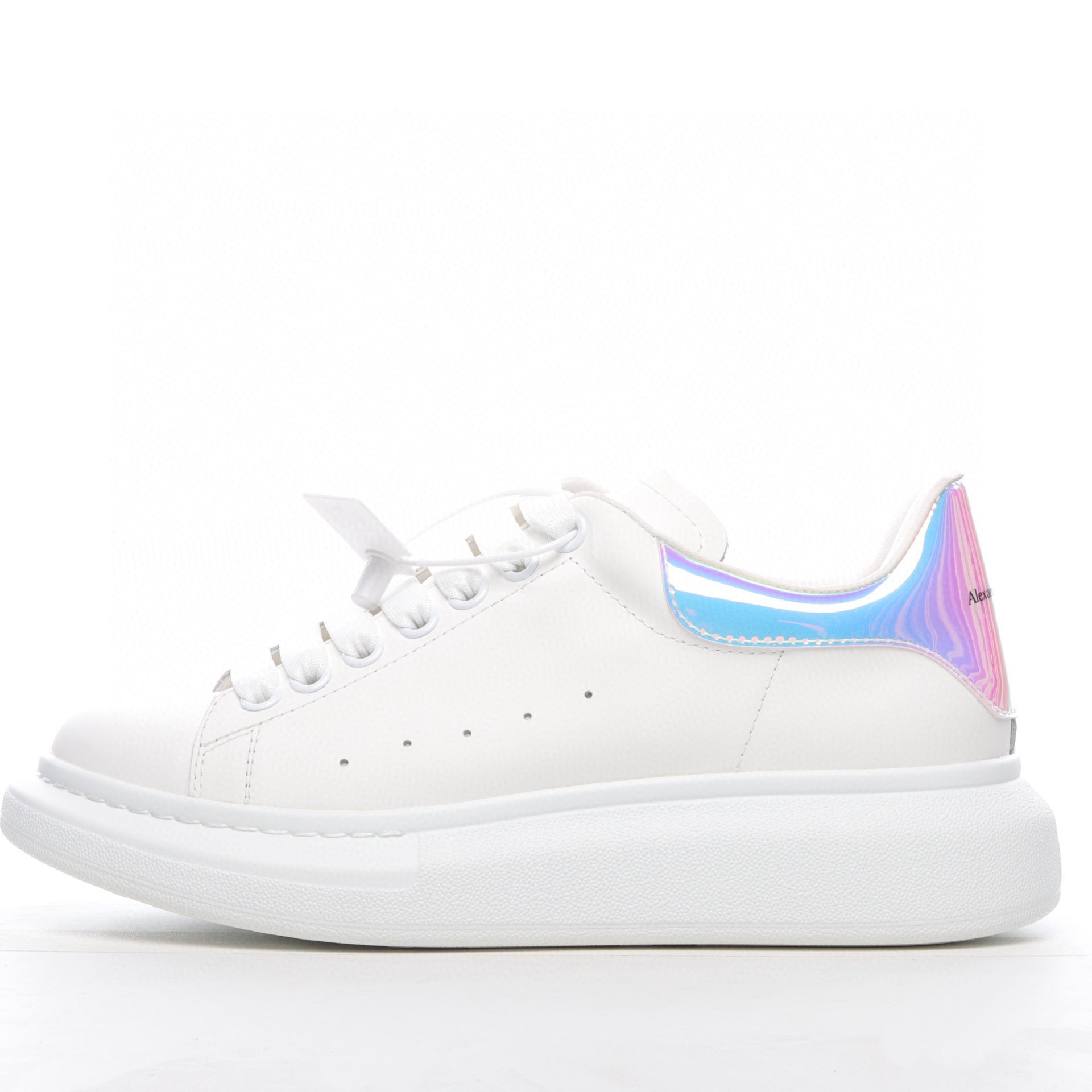 White sneaker with a colorful sole on a white background