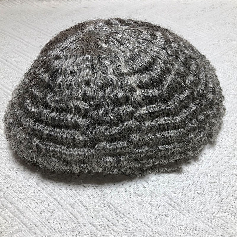 Textured gray knit cap on a light fabric background