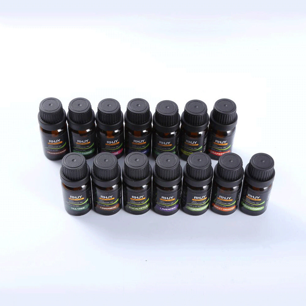 Multiple small black bottles with labels on a white background