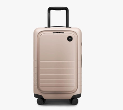 Beige suitcase with a black handle on a white background