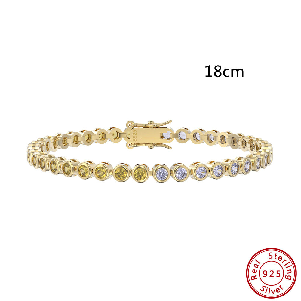 Gold bracelet with diamonds on a white background, featuring a 'Real Sterling Silver' stamp.
