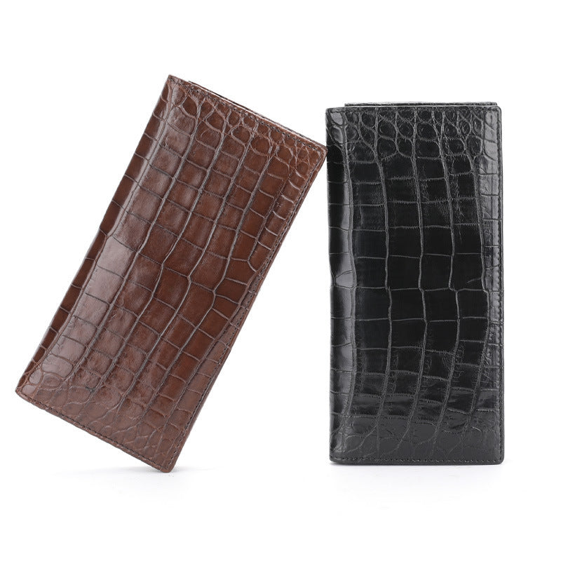 Brown and black crocodile skin wallets on a white background