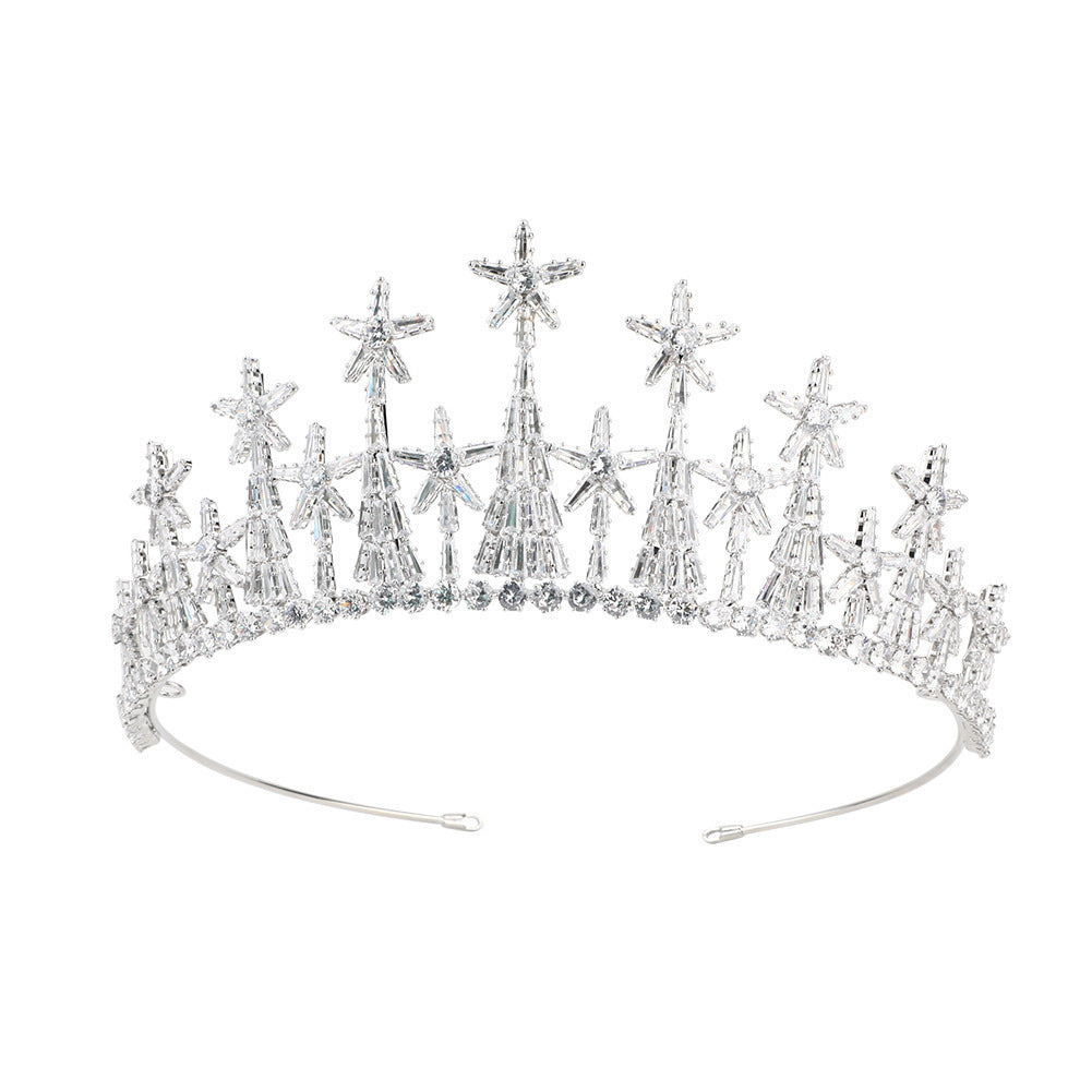 Silver tiara with star-shaped embellishments on a white background