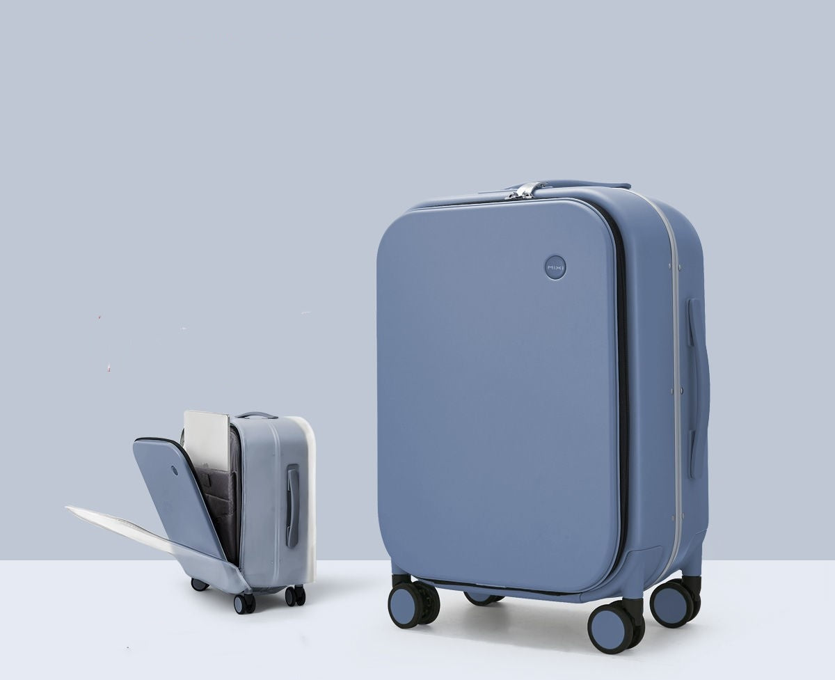 Blue suitcase with a smaller interior bag on a light gray background