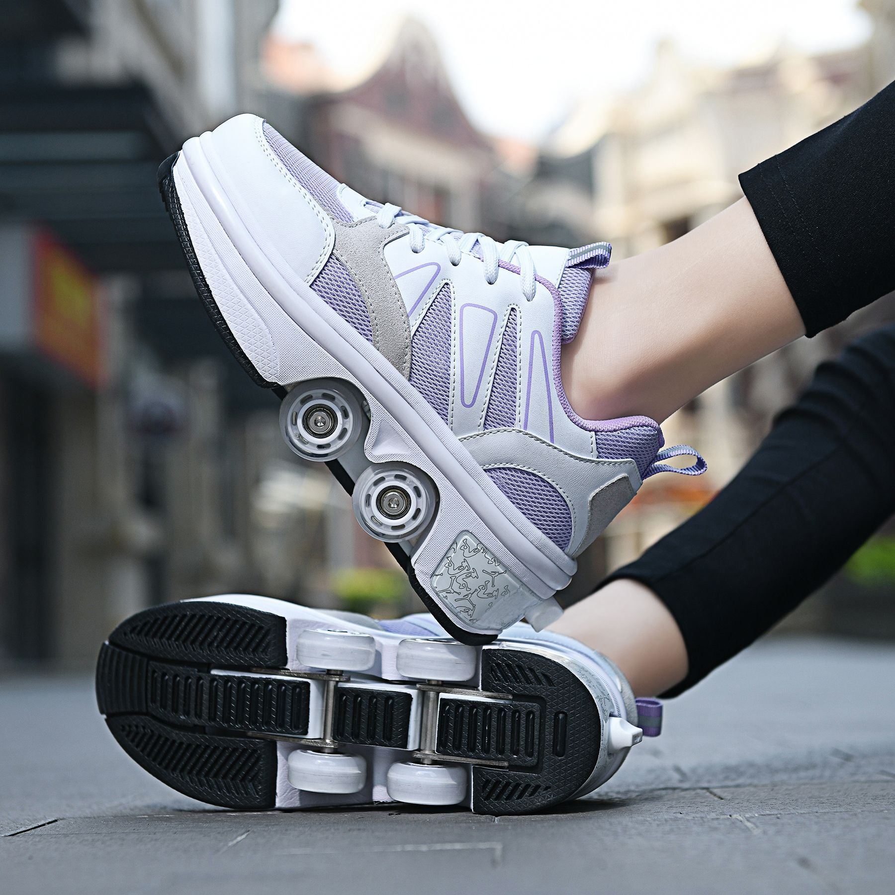 Person wearing white and purple roller shoes on a blurred street background