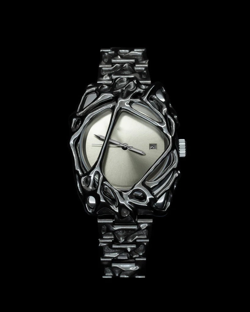 Silver wristwatch with intricate design on a black background