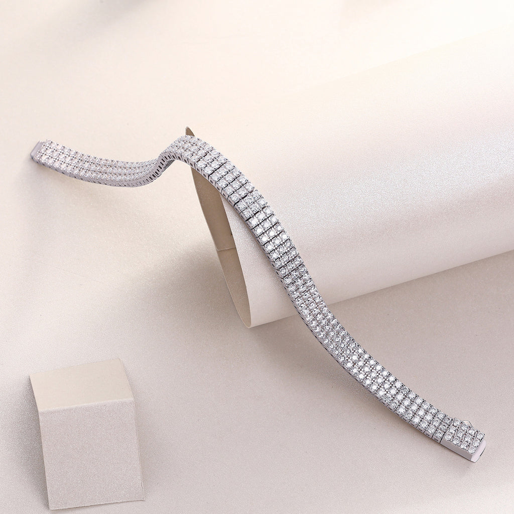 Silver belt with rhinestones on a beige background
