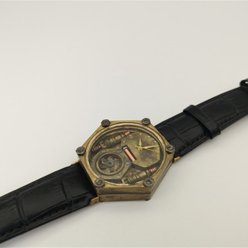 Steampunk-style watch with black strap on a light gray background
