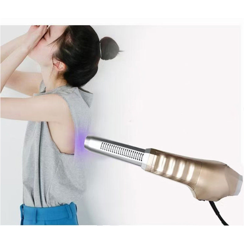 Person using a hair dryer on a plain background