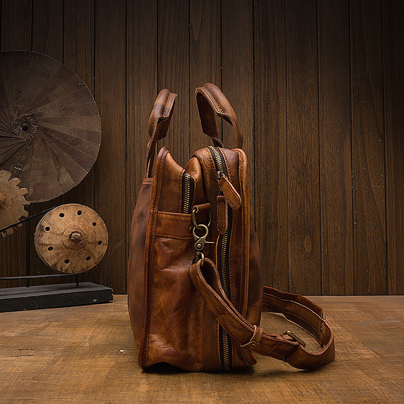 Brown leather backpack on a wooden surface with a rustic background