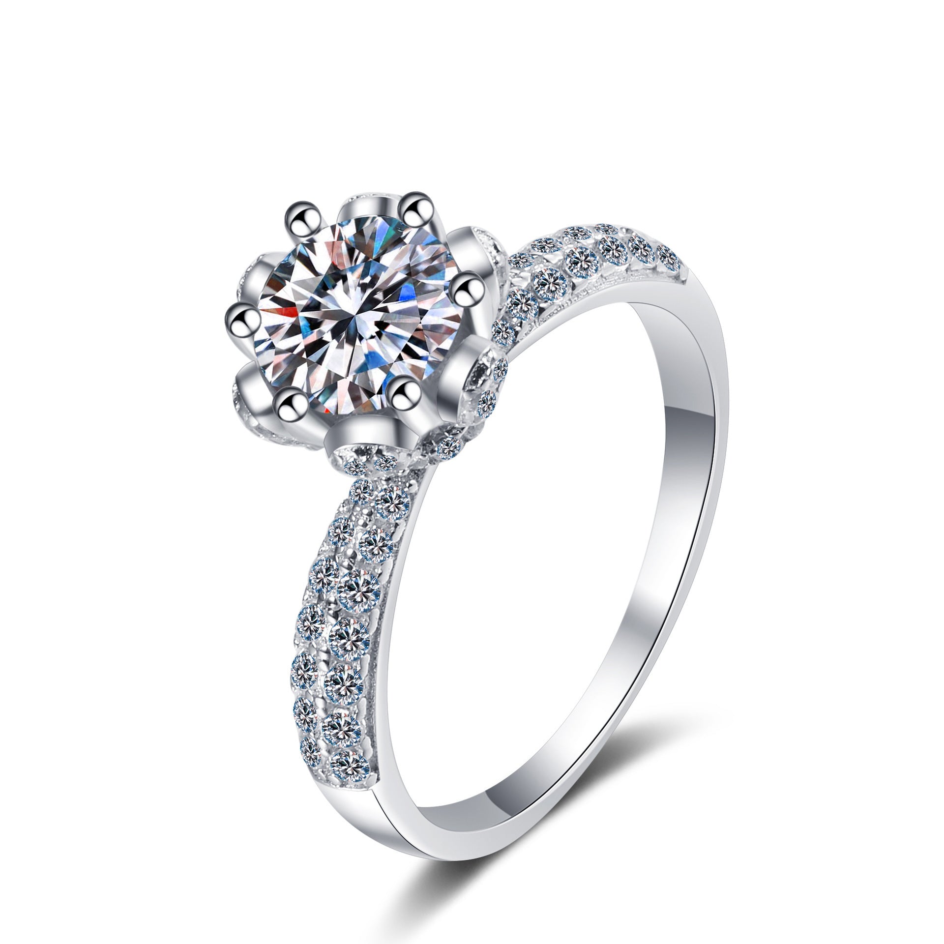 Silver ring with a large central gemstone and smaller stones on the band against a white background