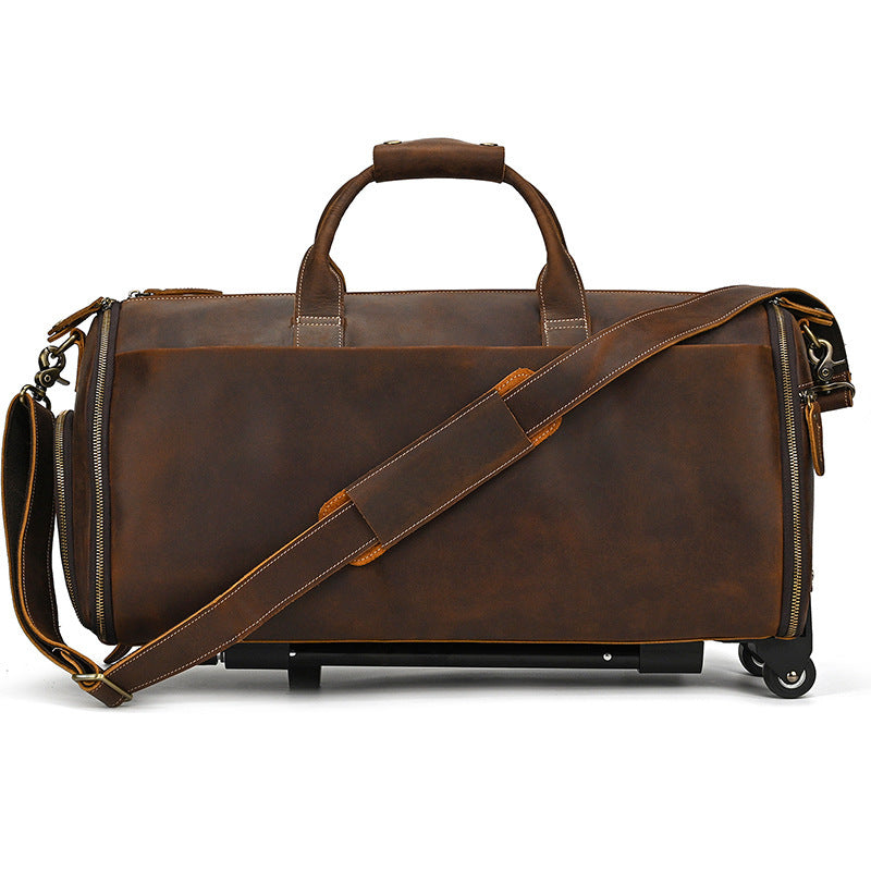 Brown leather duffel bag with wheels on a white background