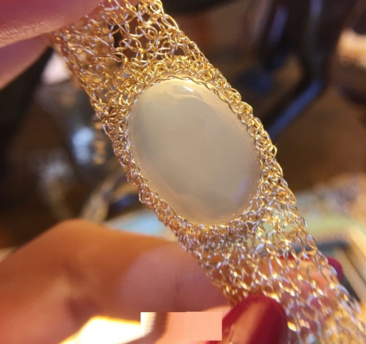 14k Gold Wire Natural White Chalcedony Bracelet featuring a delicate wire design with an oval chalcedony stone centerpiece.