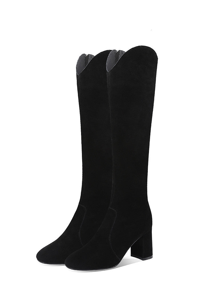 Black knee-high boots on a white background