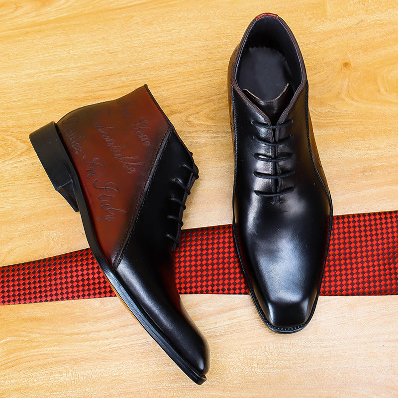 Black dress shoes on a wooden surface with a red and black checkered ribbon.