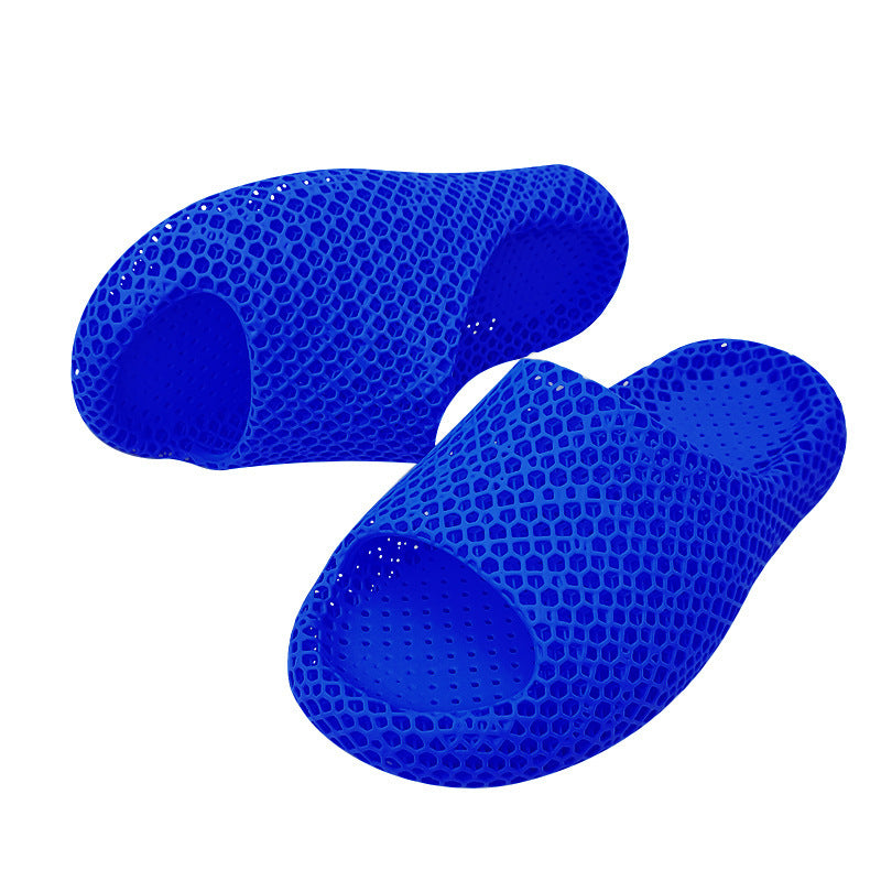 Pair of blue honeycomb-patterned slippers on a white background